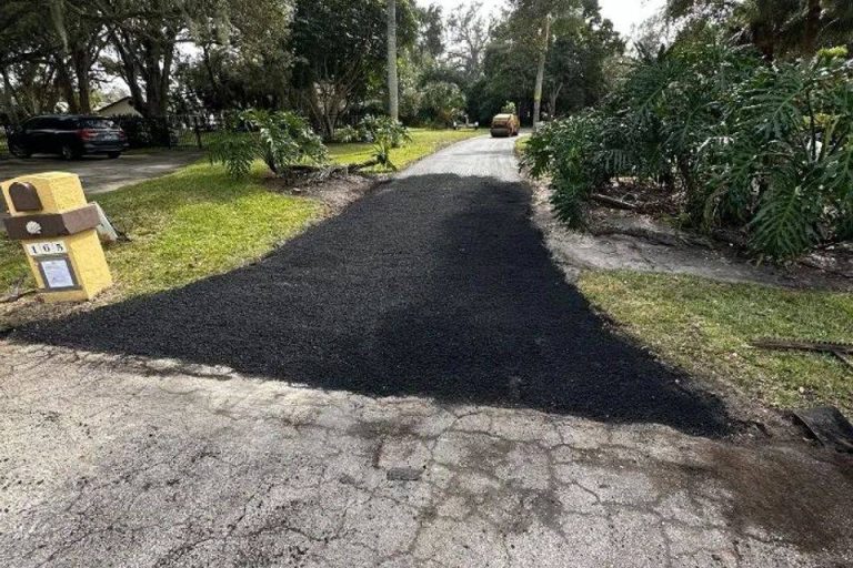 New asphalt driveway being paved