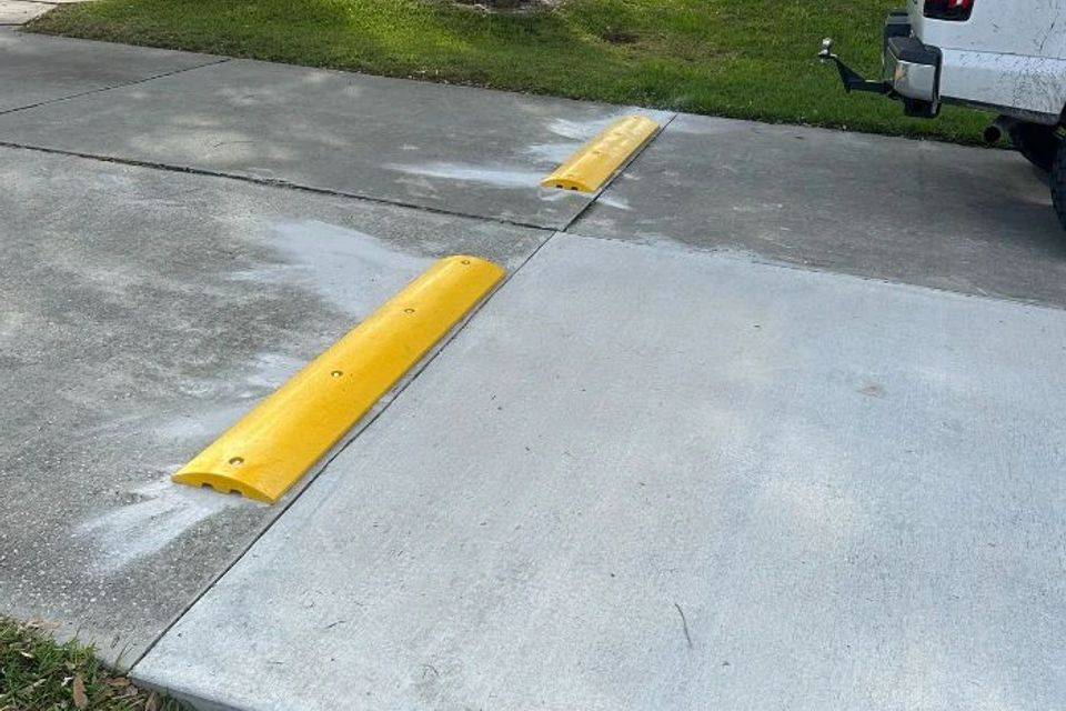 Yellow speed bump installed by All Brevard Asphalt, photo 2
